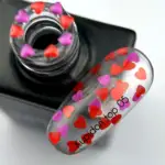 NAILSOFTHEDAY Kupidon top 05 - Top Coat mit roten und rosafarbenen Herzchen ohne klebrige Schicht, 10 ml